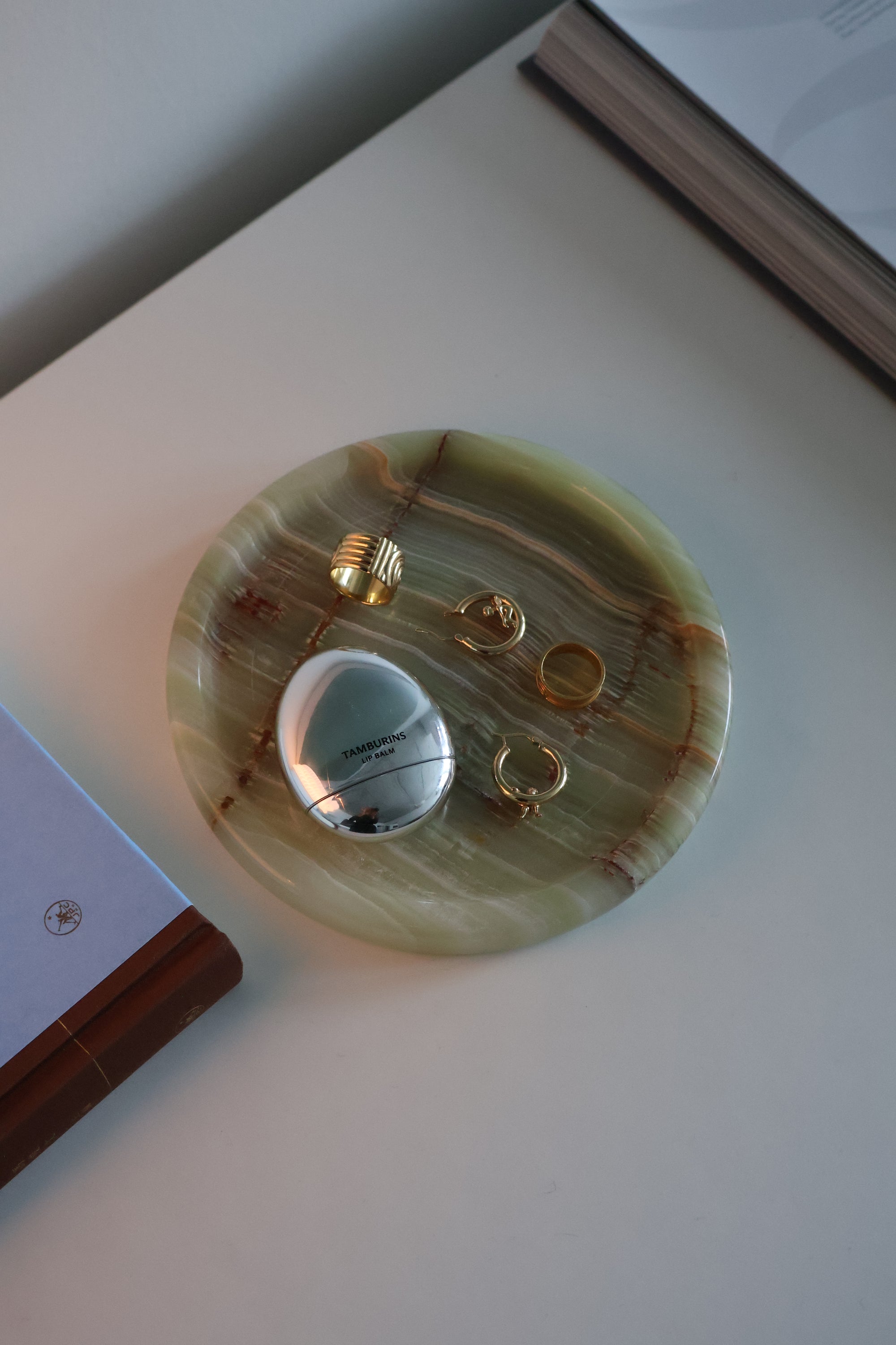 Round decorative object on a white surface with a blurred background