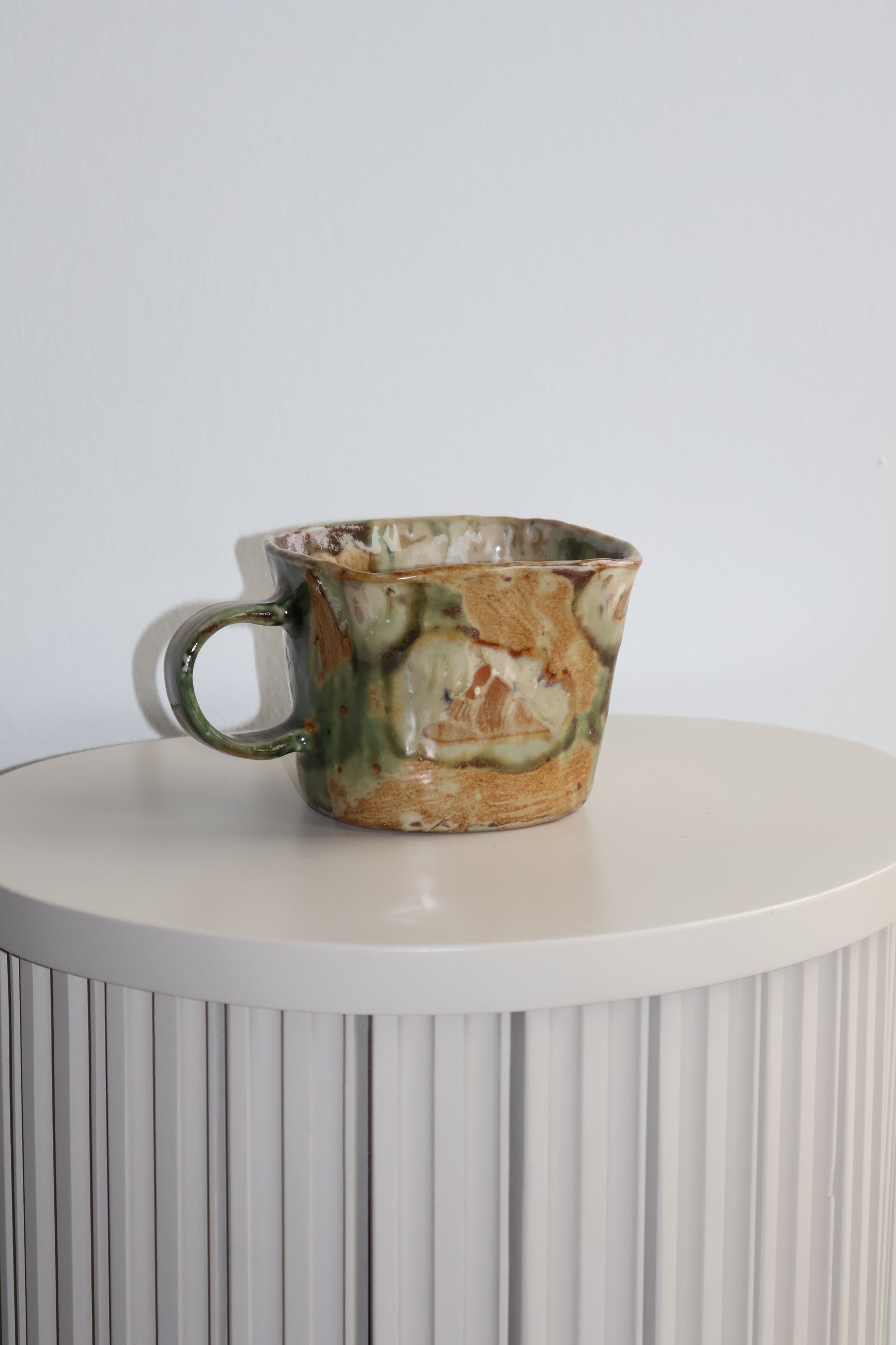 Vintage ceramic teacup on a white background